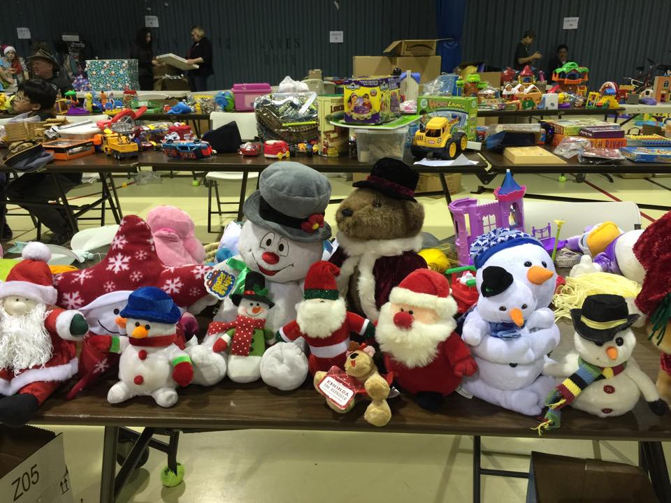 Once the toys are transported to the event we help put them on display for all the kids